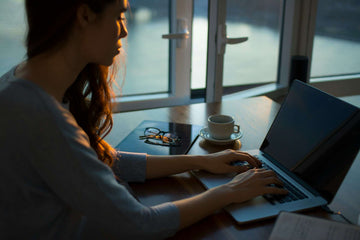 Woman concentrating on her laptop computer 